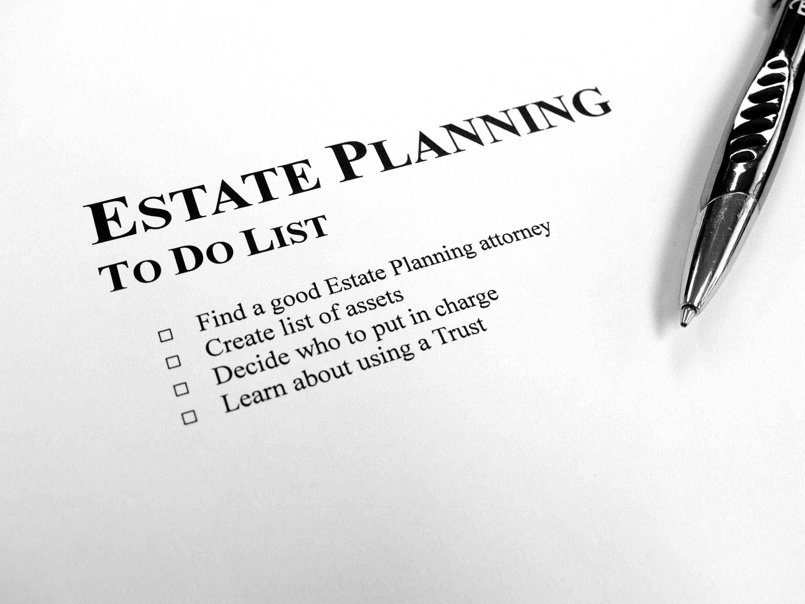 Estate Planning To Do List on Desk with Pen Passing on your assets to future generations can be a tricky task. Be sure to hire an experienced Trust Attorney to help you through the process.